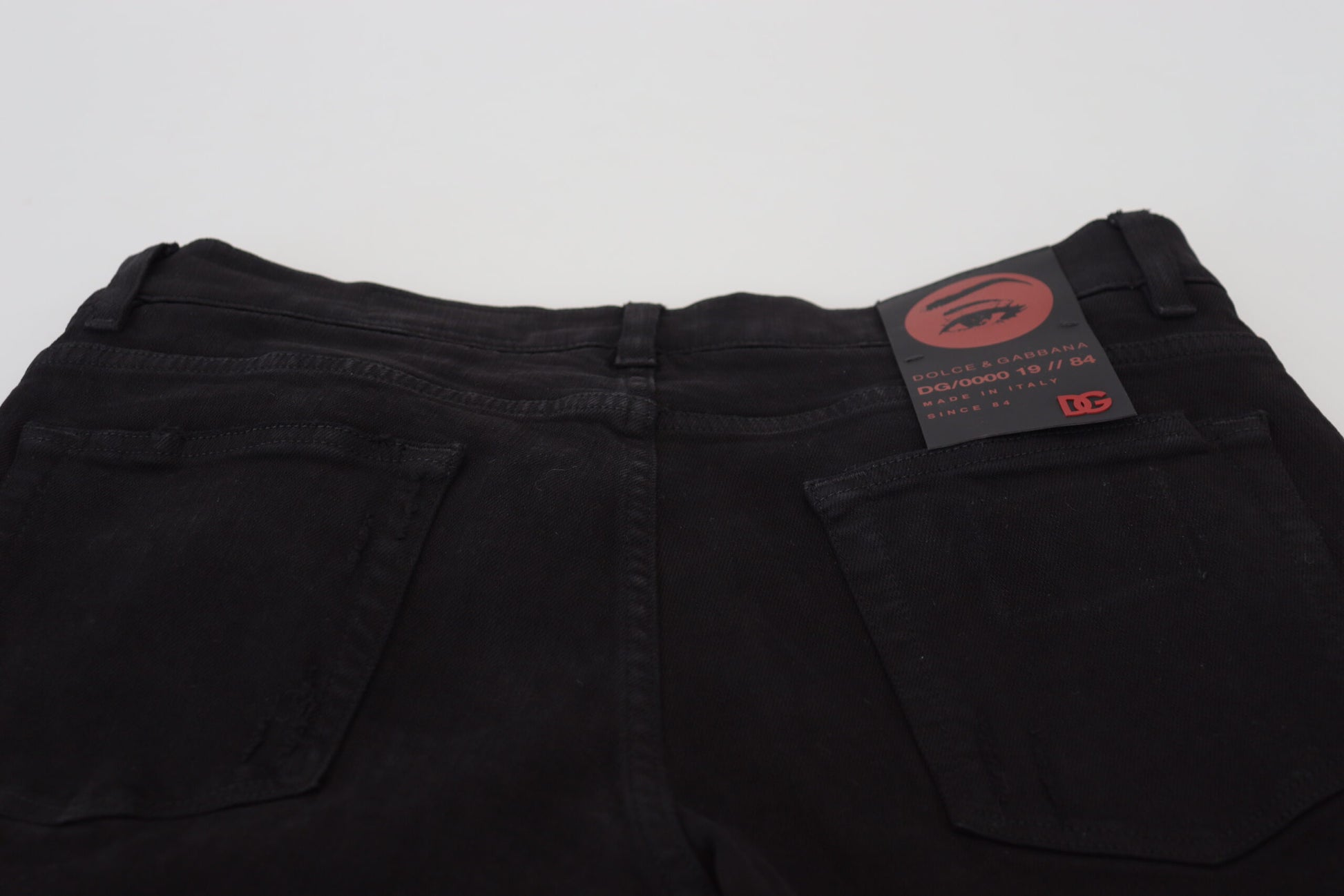 Schwarze Slim Fit Jeans aus zerfetztem Baumwolldenim