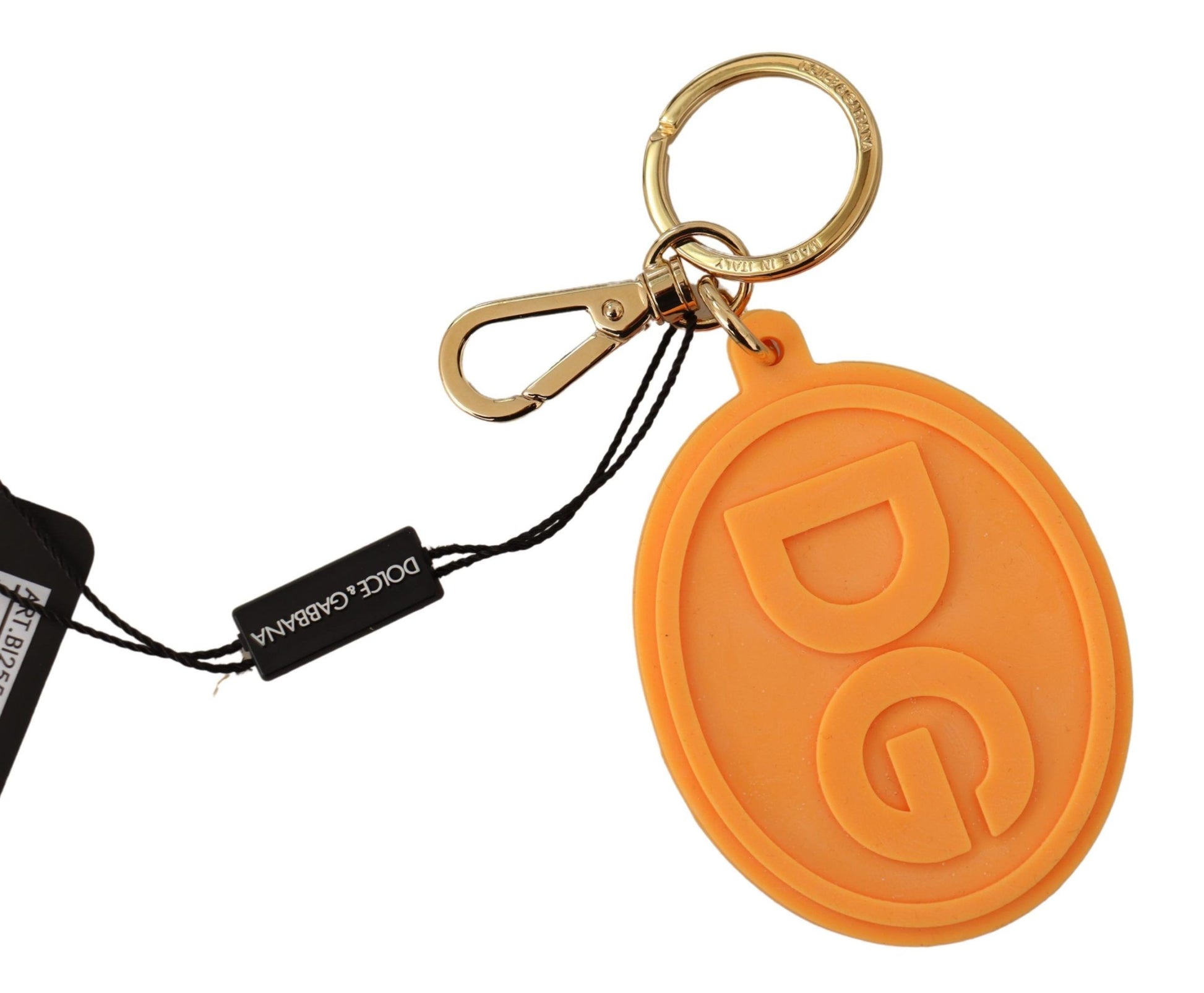 Orangefarbener Schlüsselanhänger mit DG-Logo aus Gummi und goldenem Messing