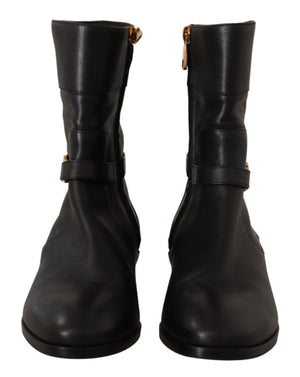 Schwarze flache Lederstiefel mit Logo