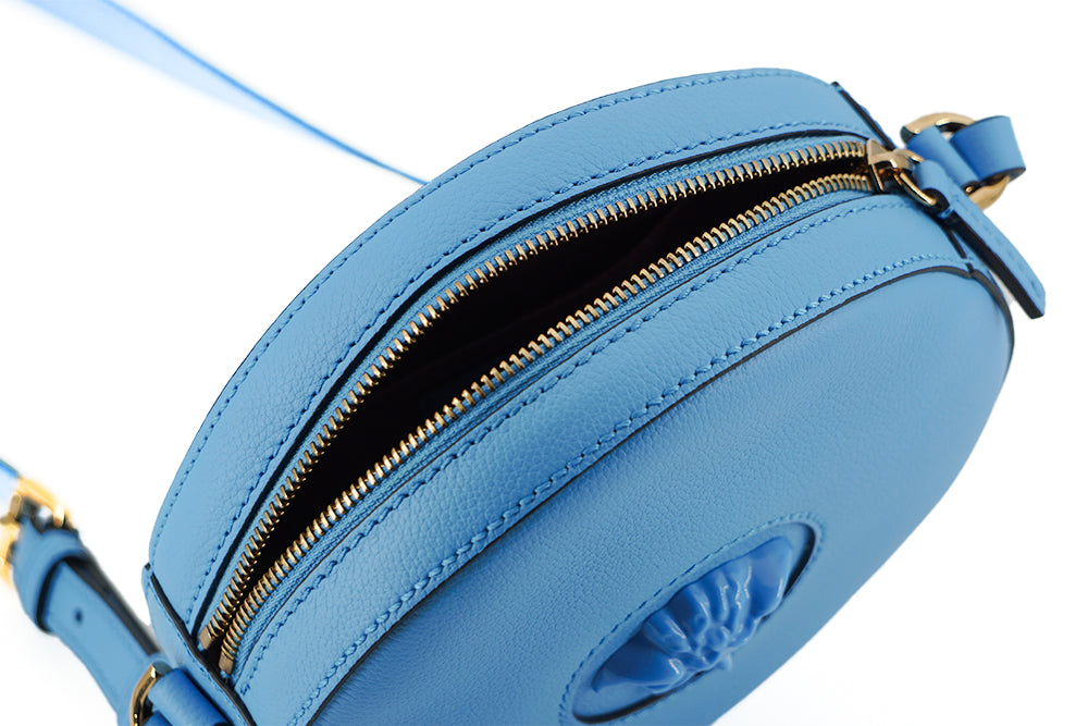 Schicke runde Umhängetasche aus blauem Leder