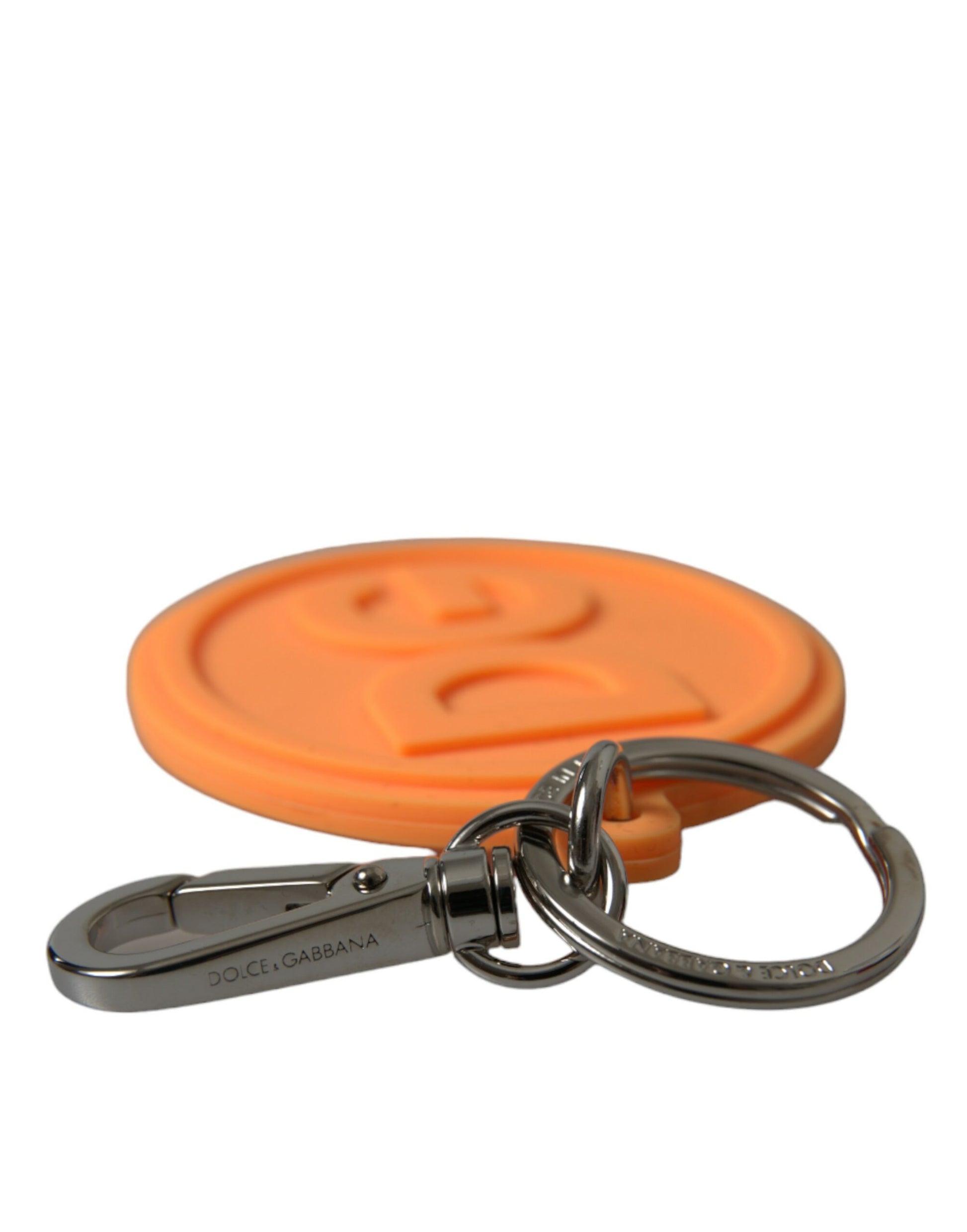 Schlüsselanhänger mit DG-Logo aus orangefarbenem Gummi und silbernem Messingmetall
