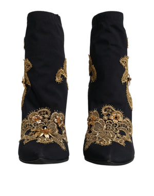 Schwarze Slipper mit goldener Stickerei