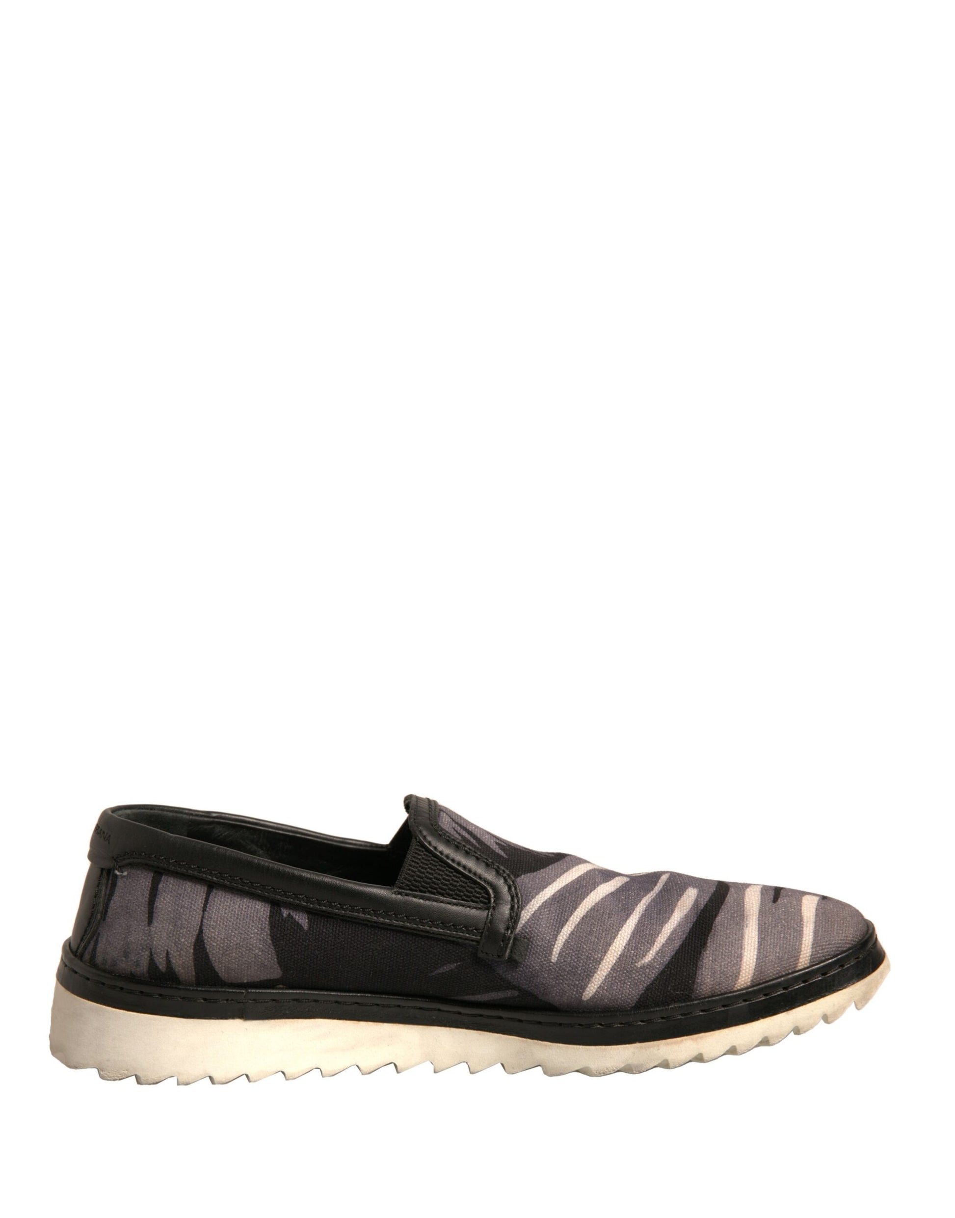 Schwarze Slipper aus Canvas mit tropischem Print
